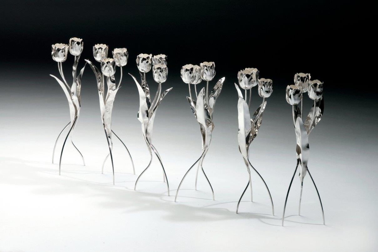 Six candle holders DANCING TULIPS. Designed and executed by Dutch silversmith Wouter van Baalen. Gift from the Government of the Kingdom of the Netherlands to Her Majesty Queen Beatrix on the occasion of her Silver Jubilee as Head of State in 2005. Designed and executed by silversmith Wouter van Baalen. Schoonhoven 2005